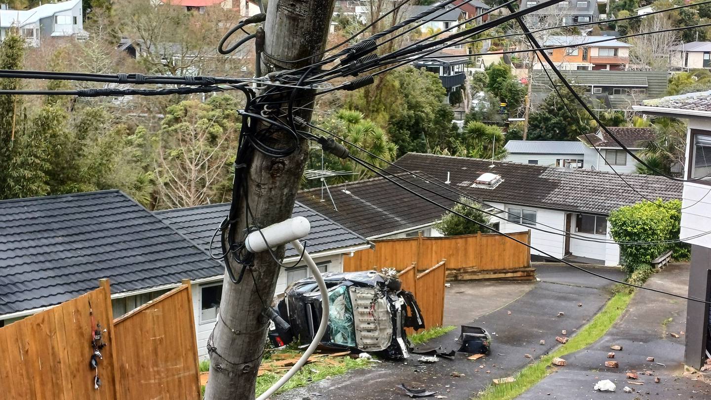 The wreck of a car that crashed on Woodlands Cres in Browns Bay. Photo / Chris Allen