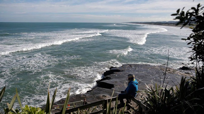 A dead body was found in water north of Muriwai Beach this morning. Photo / Alex Burton