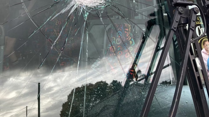 A rock came through the front window of a Tranzit bus full of schoolkids on Friday, narrowly missing the driver.