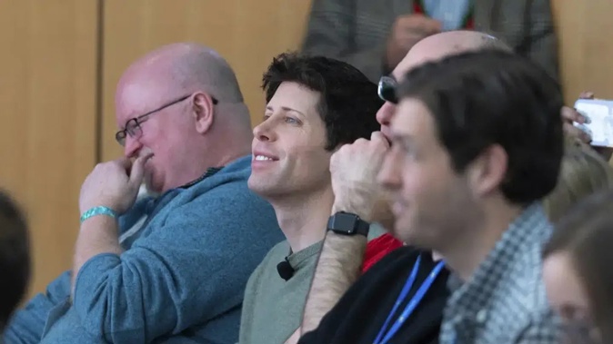 OpenAI CEO Sam Altman, second from left, watches a presentation introducing the integration of Bing and Edge with OpenAI. Microsoft is fusing ChatGPT-like technology into its search engine Bing, transforming a service that now trails far behind Google. Photo / AP, Stephen Brashear