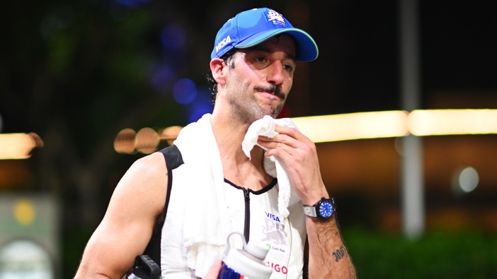 18th Placed Daniel Ricciardo of Australia and Visa Cash App RB looks on in the Paddock after the F1 Grand Prix of Singapore at Marina Bay Street Circuit on September 22, 2024 in Singapore, Singapore. (Photo by Rudy Carezzevoli/Getty Images)
