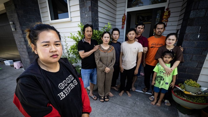 Sky Duong (front) with some members of the group that paid thousands for work visas but arrived in NZ to non-existent jobs.