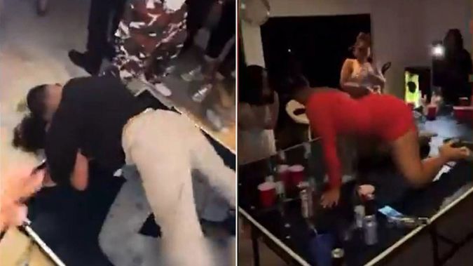 Videos of a party held on Saturday show an apartment packed with at least 50 young adults drinking, dancing and kissing, with some gyrating together on a table. (Photo / NZ Herald) 