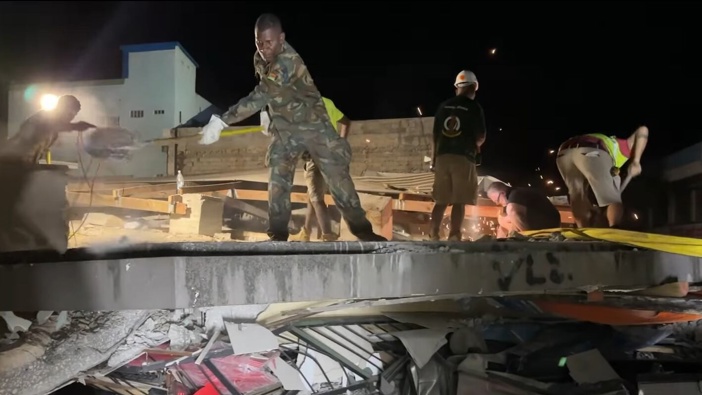 Search and rescue teams work to find people trapped in collapsed buildings in Vanuatu's capital Port Vila after a 7.3 earthquake struck. Photo / Michael Thompson