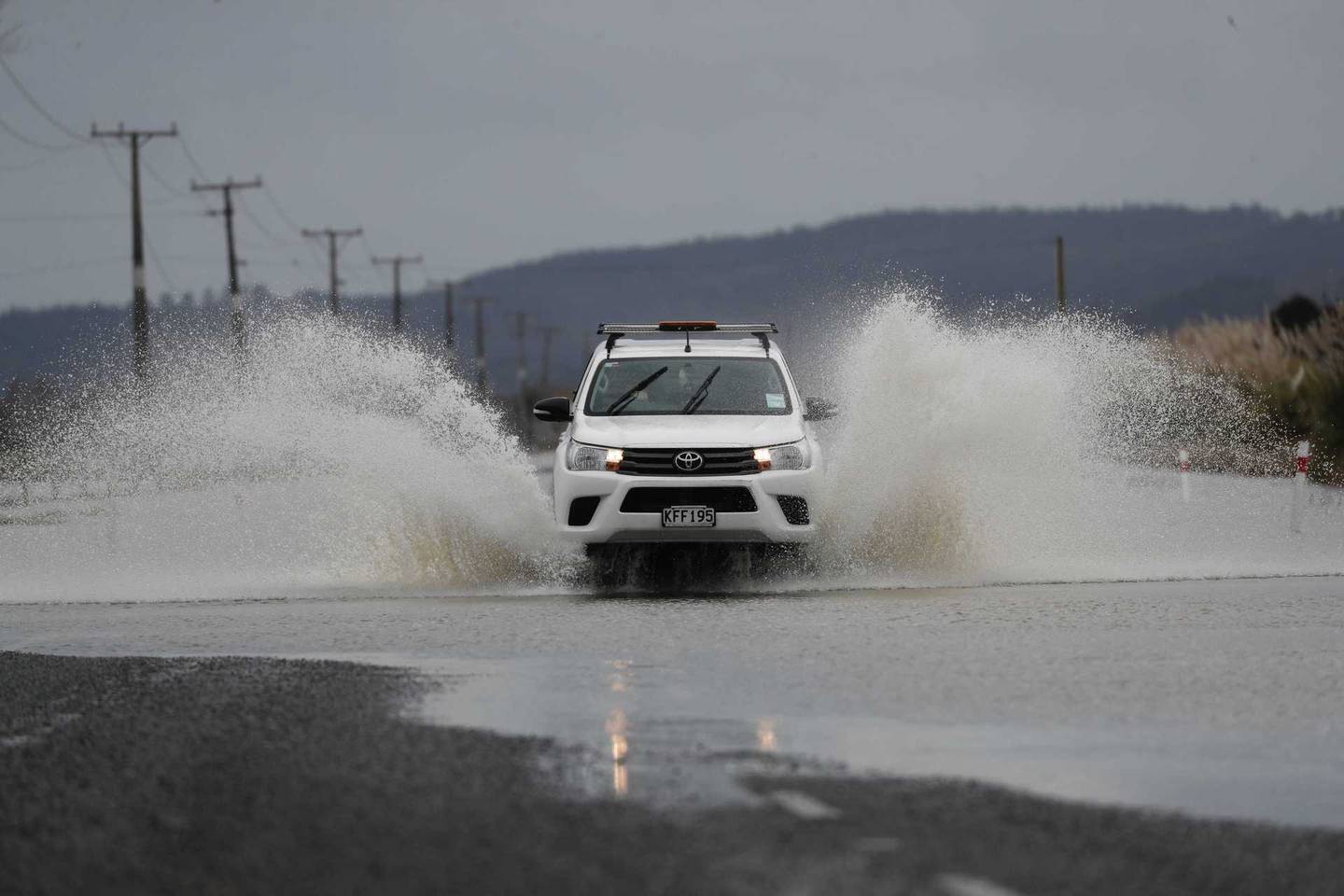 Floodwaters are still causing trouble in the West Auckland area. Photo / Dean Purcell