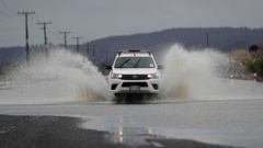 Floodwaters are still causing trouble in the West Auckland area. Photo / Dean Purcell