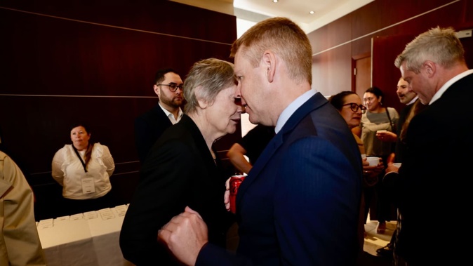 Labour leader Chris Hipkins and former PM Helen Clark catch up at Hipkins' State of the Nation speech. Photo / Dean Purcell