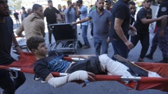 A Palestinian wounded in Israeli bombardment is brought to a hospital in Deir al-Balah, south of the Gaza Strip. Photo / AP