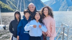 Tegan Chen (centre) with mum Deb Fung, dad Adrian Chen and her two brothers in Milford Sound.