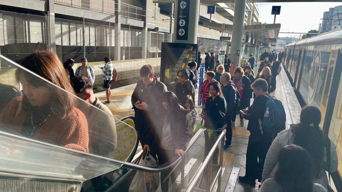 Queues file off trains at Newmarket Station after a track fault on the Eastern line.