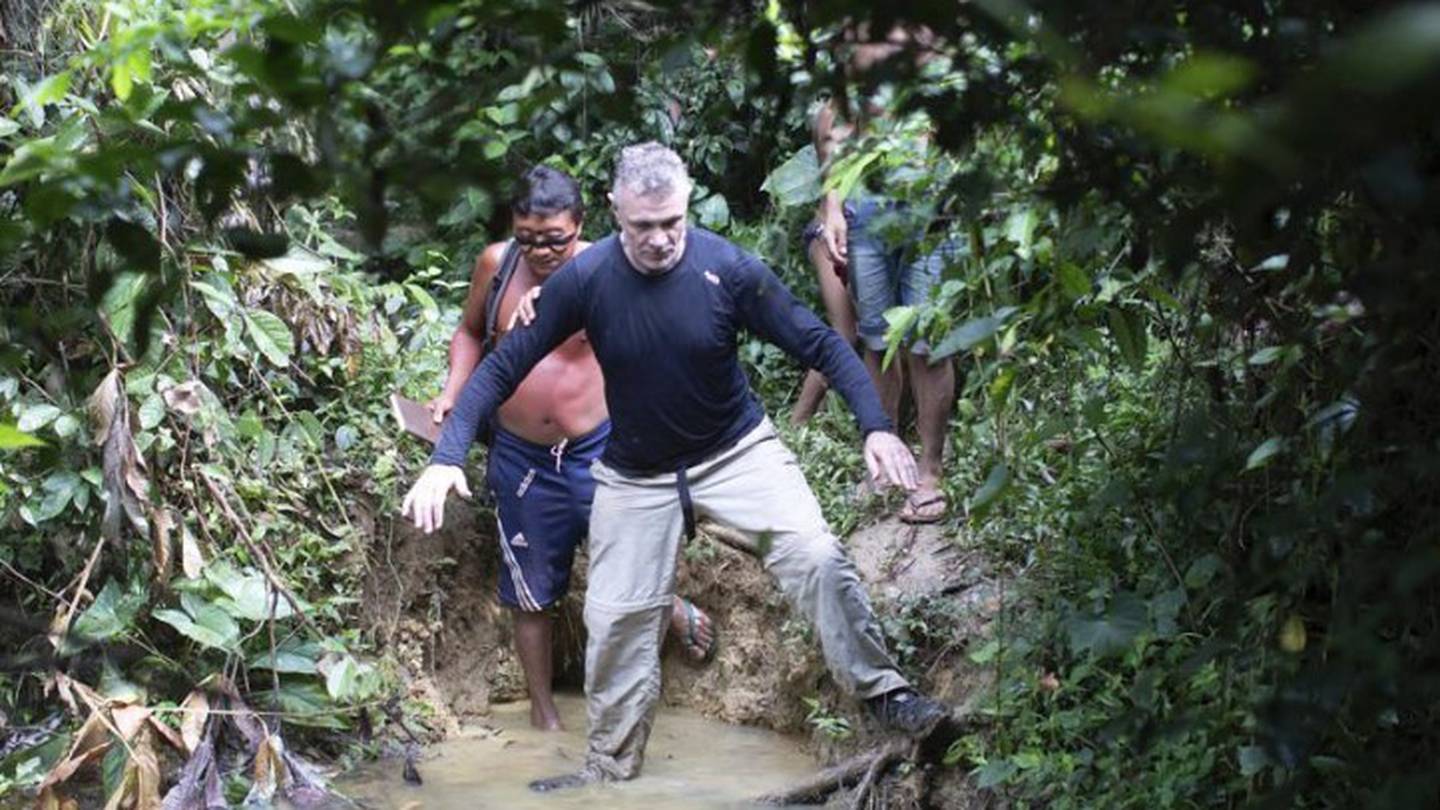 British journalist Dom Phillips (right) and a Yanomami Indigenous man walk in Maloca Papiu village, Roraima state, Brazil. Photo / AP