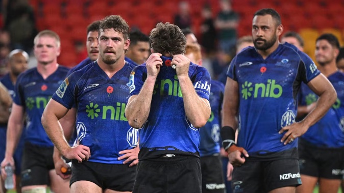 Beauden Barrett leads the Blues from the field following their Super Rugby Pacific defeat to the Reds. Photo / Photosport