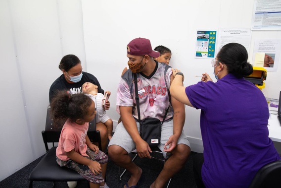 The parents of the Tavalu family recieve their second Pfizer jab at the Westgate Covid-19 Vaccination Centre in Auckland on Thursday, January 6, 2022. (Photo / Sylvie Whinray)