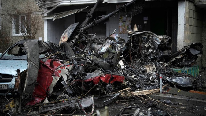 A view of the scene where a helicopter crashed on civil infrastructure in Brovary, on the outskirts of Kyiv, Ukraine. Photo / AP