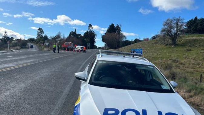 Police divert traffic away from a crash in north Otago. Photo / Otago Daily Times