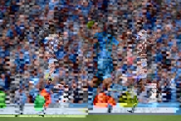 Manchester City's Rodrigo runs to celebrate after scoring his side's second goal against Aston Villa. Photo / AP