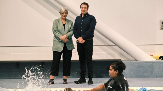 Royston Health trust chair Jacqui Gray with HBCFCT commercial and partnerships manager Greg Howie watch children learning to swim at the Hawke’s Bay Regional Aquatic Centre in Hastings.
