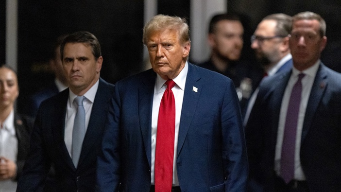 Former US President Donald Trump, center, and Todd Blanche, attorney for former US President Donald Trump, second left, at Manhattan criminal court in New York, US, on Thursday, April 25, 2024. Photo / Jeenah Moon | Bloomberg via Getty Images