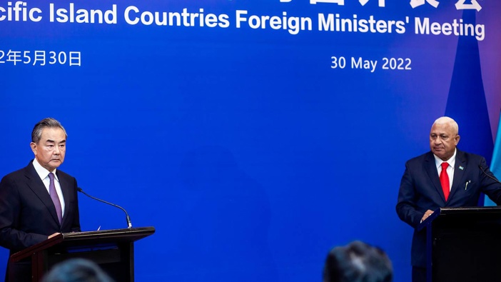 China's Foreign Minister Wang Yi (left) appears on stage at the Pacific Islands Foreign Ministers' meeting today with Fiji's Prime Minister Frank Bainimarama in Suva, Fiji. Photo / AP