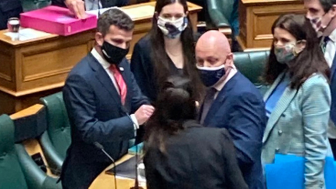 Chris Luxon and Jacinda Ardern shook hands before Question Time on Tuesday. (Photo / Claire Trevett)