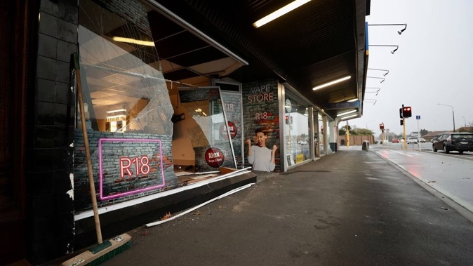 The owner showed photos of a ute that had been reversed into the front of the shop. Photo / George Heard
