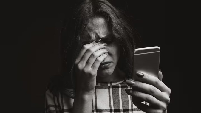 A victim living in hiding was shocked to get a call from a stranger saying they'd been sent her private hospital information – including details she has been working hard to keep secret. Photo / 123rf