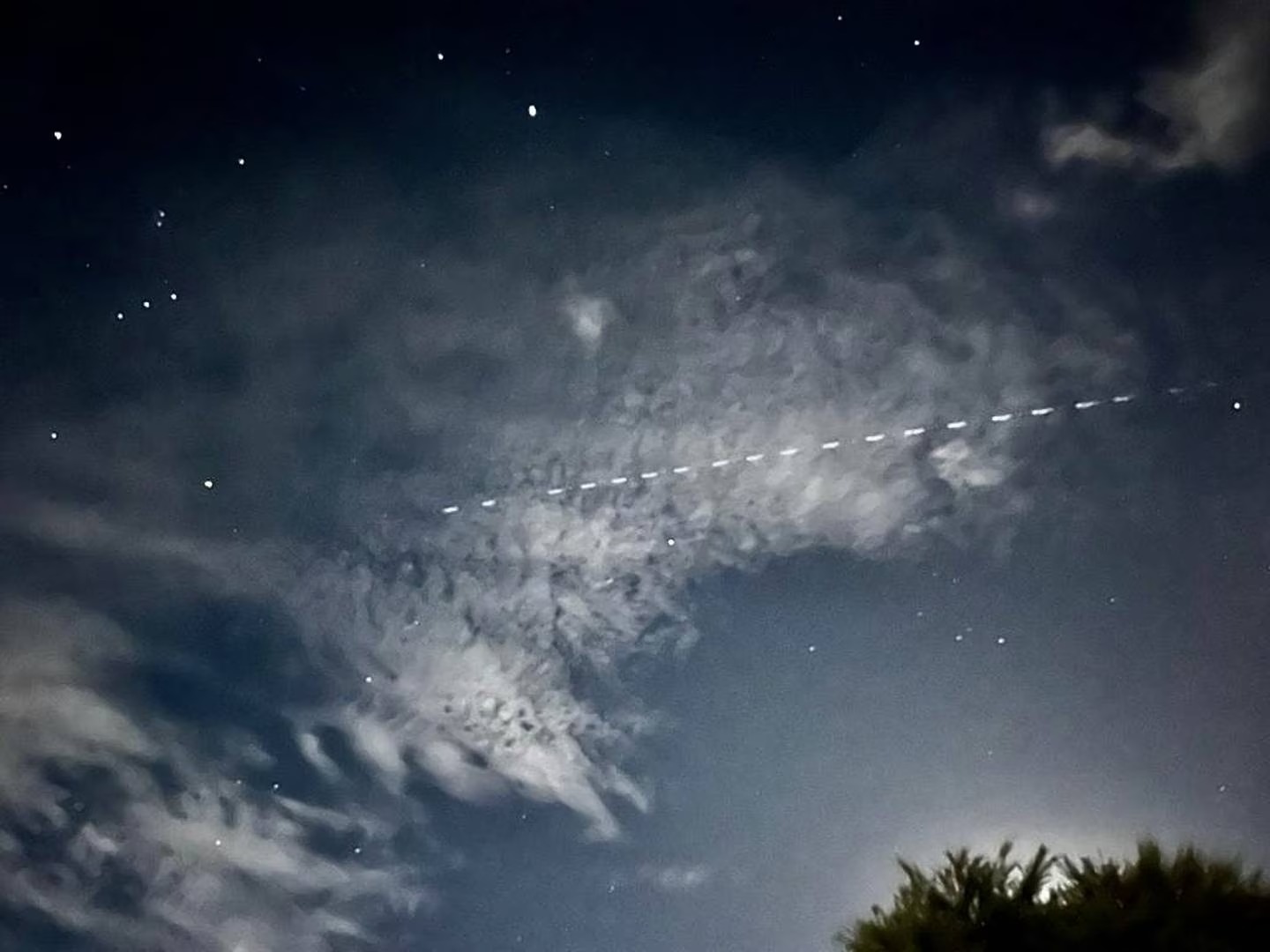 A lucky photographer captured a train of SpaceX's Starlink satellites on camera last night above Auckland. Photo / Sky Stansfield