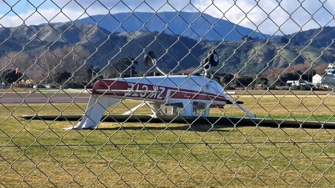 A small two-seater plane at At Kāpiti Airport was flipped upside down by the whirling winds. Photo / NZME
