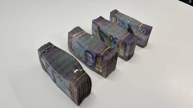 Some of the $70,000 in cash seized following a search warrant in the Whanganui area.
