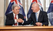 National leader Christopher Luxon and NZ First leader Winston Peters shaking hands after signing their coalition agreement at Parliament, 24 November 2023. NZME photograph by Mark Mitchell