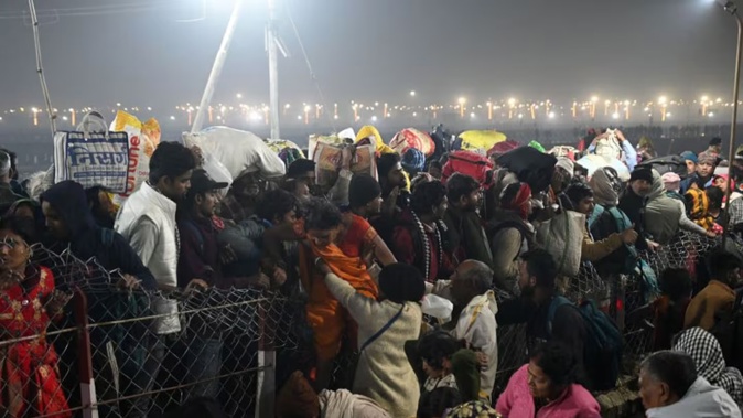 Devotees trying to cross the barricades after a deadly stampede before the second Shahi Snan, at Maha Kumbh Mela, on January 29, 2025 in Prayagraj, India. Photo / Getty Images