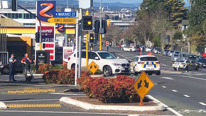 A crashed BMW with no number plates. A witness reported seeing a man flee from police before crashing the car. (Photo / Supplied)