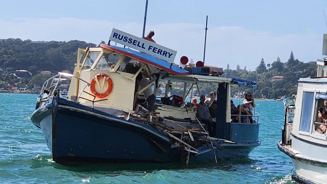 Passengers on the stricken Blue Ferry wait to be rescued by the Happy Ferry. Photo / Elliot Bexon