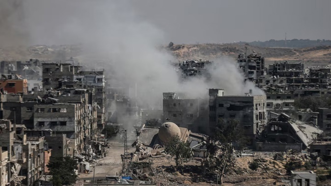 Smoke rises after an Israeli attack on Jabalia camp in the northern Gaza on August 31. Detective Chief Superintendent Helen Flanagan, of the Metropolitan Police’s Counter Terrorism Command, said it was a 'false narrative' that the proscription of Palestine Action would bar people from supporting Palestinians. Photo / Getty Images