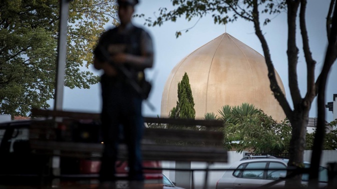 Armed Police guard the Masjid Al Noor, Deans Avenue Mosque, Christchurch. Photo / Michael Craig
