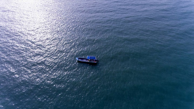 One night the family boarded a rickety wooden boat and set out for South Korea. Photo / 123rf