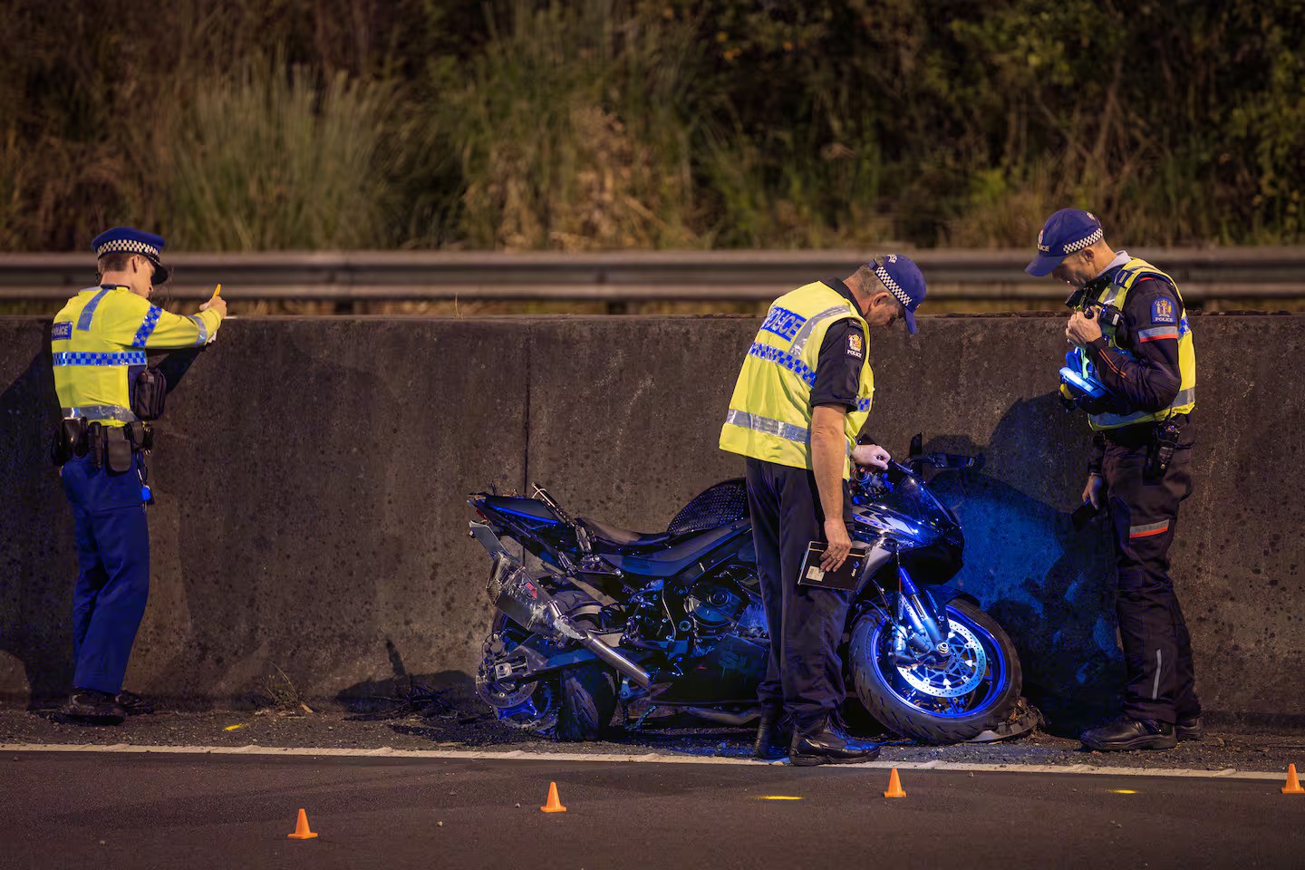 Police at the scene of the serious crash involving a motorcyclist near Grafton Rd in Auckland Central. Photo / Hayden Woodward