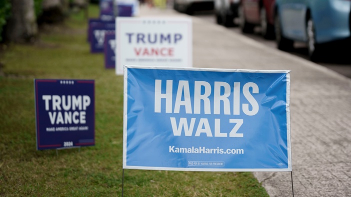 Campaign signs for former US President Donald Trump and US Vice President Kamala Harris outside a polling location for the 2024 Presidential election at the Mandel Community Center in Palm Beach, Florida, US, on Tuesday, Nov. 5, 2024. Photo / Josh Ritchie/Bloomberg via Getty Images