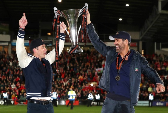 Rob McElhenney and Ryan Reynolds, Owners of Wrexham celebrate with the Vanarama National League trophy. Photo / Getty