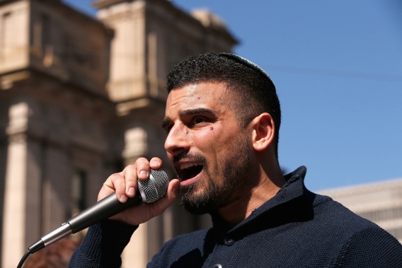 Avi Yemini speaking to right-wing protesters in Melbourne in 2017. Photo / Getty Images