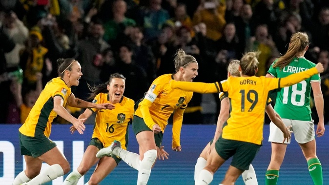 Australia's Steph Catley celebrates after scoring the opening goal from the penalty spot against Ireland. Photo / AP