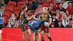 The Reds defeated the Blues 35-21 in Brisbane on Friday night. Photo / Photosport