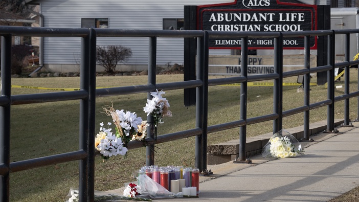 A makeshift memorial sits in front of Abundant Life Christian School as police continue to investigate yesterday's shooting on December 17, 2024 in Madison, Wisconsin. Multiple people were reported shot and at least three have died after a student opened fire in the school. (Photo by Scott Olson/Getty Images)