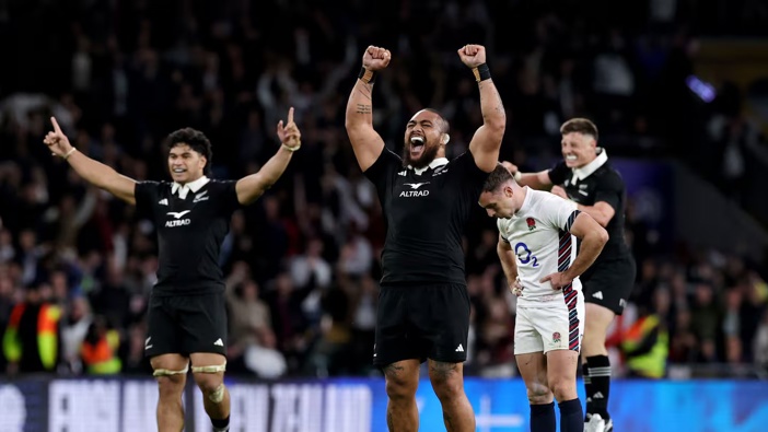 Ofa Tu'ungafasi of the All Blacks celebrates at fulltime as George Ford of England looks dejected. Photo / Getty Images