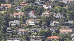 The median house price in Auckland has fallen 3.4% in a year, dropping to $990,000 - but price growth in the regions is keeping the market stable on the surface. Photo / Michael Craig