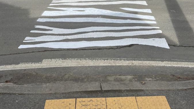 The quirky zebra crossing on Black Jack Road in Kuaotunu was painted during the night by frustrated residents. (Photo / Brent Page)