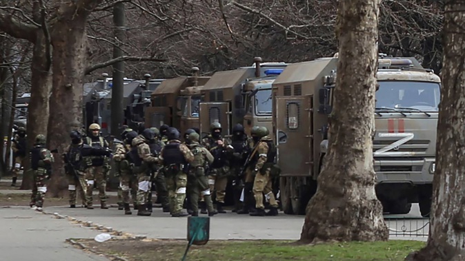 In this file photo, Russian army soldiers are pictured in Svobody (Freedom) Square in Kherson, Ukraine, during their occupation. Russia's military has announced it is withdrawing from the city and nearby areas. That would be another in a series of humiliating setbacks for Moscow's forces in the 8-month-old war. Photo / AP file