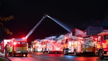 Firefighter hospitalised after suffering injuries in large Auckland blaze