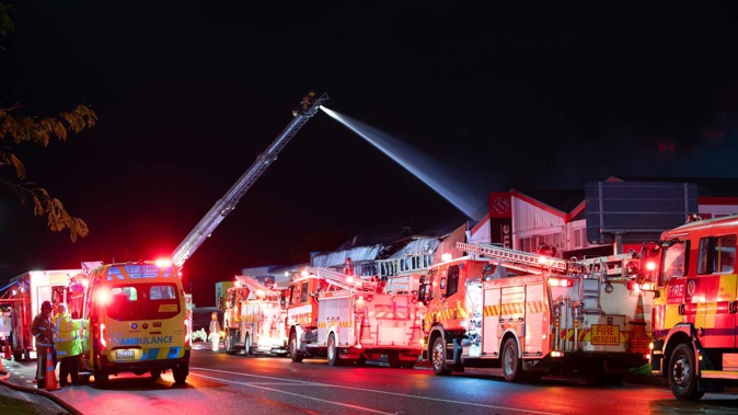 Firefighters from around the city were called to a blaze on Walters Rd in Takanini, South Auckland, overnight. Photo / Hayden Woodward
