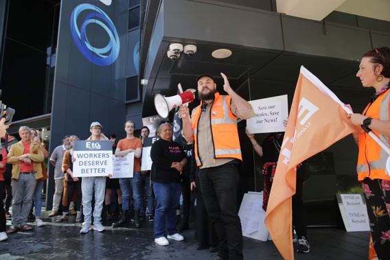 Baz Mcdonald speaking to the crowd outside TVNZ. Photo / Sylvie Whinray